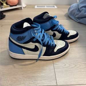 Air Jordan 1 High Top Sneakers in color obsidian